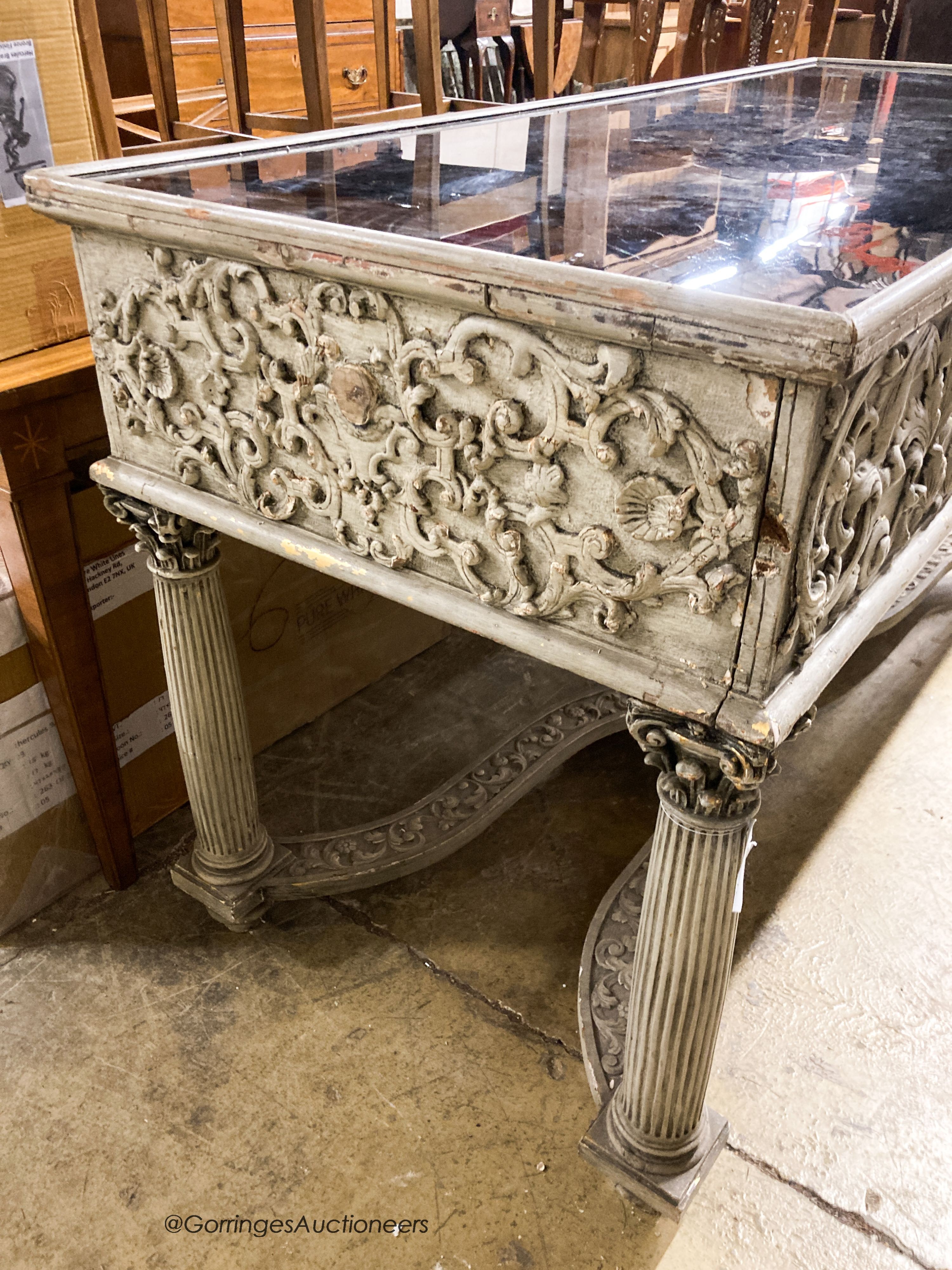 An 18th century style painted two drawer glass top console table, width 180cm, depth 73cm, height 95cm